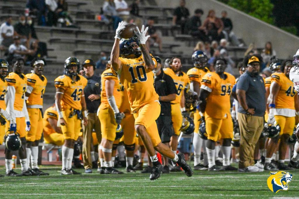 College of the Canyons wide receiver Andre Hunt hauls in his second touchdown of the game during the first half of the No. 5 Cougars' 42-30 victory over No. 21 Palomar College on Saturday night at Cougar Stadium. —Dylan Stewart/1550 Sports