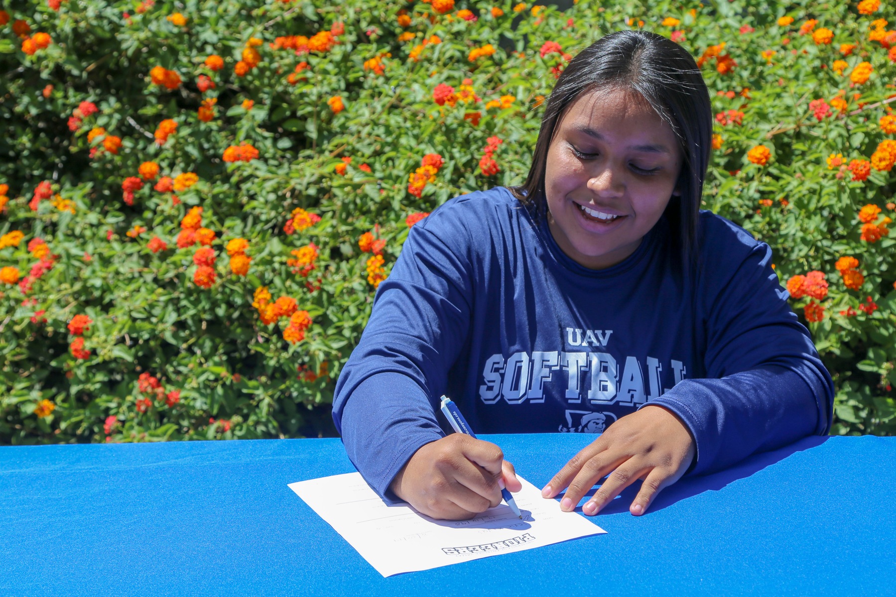 COC infielder Valerie Rivas signs her NLI with Antelope Valley University on Aug. 19, 2019.