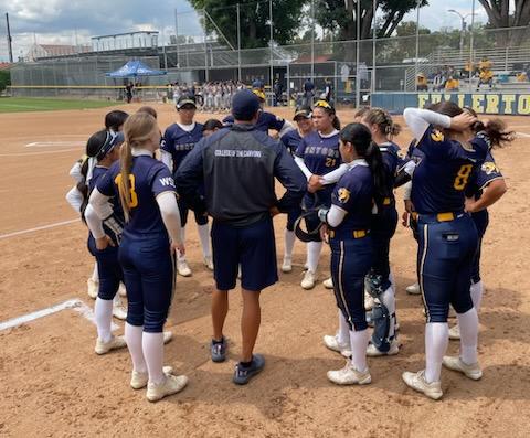 Stock image of College of the Canyons softball team in a huddle on the field at Fullerton College on March 5, 2023.