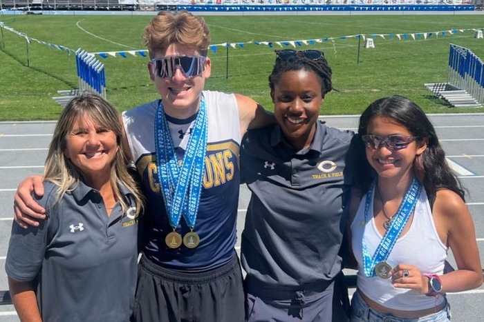 College of the Canyons track & field head coach Lindie Kane with student-athlete Layne Buck, assistant coach Jasmine Hall, and student-athlete Milca Osorio during the 2023 CCCAA Track & Field State Championships at Modesto Junior College on May 20, 2023.