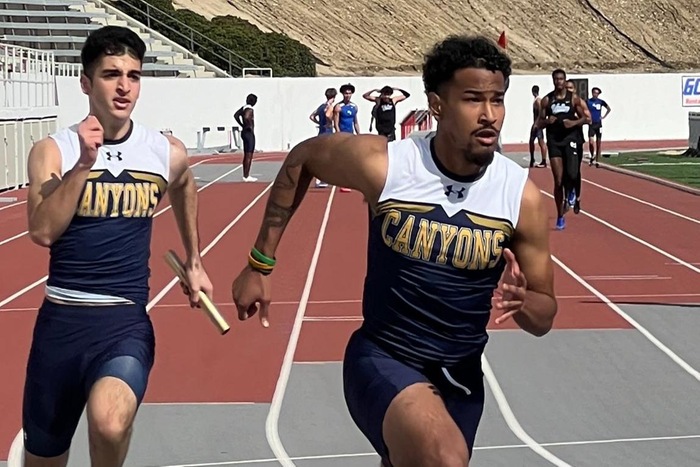 Stock action image of College of the Canyons men's track & field 4x100 relay team during event at Bakersfield College on Feb. 9, 2024.