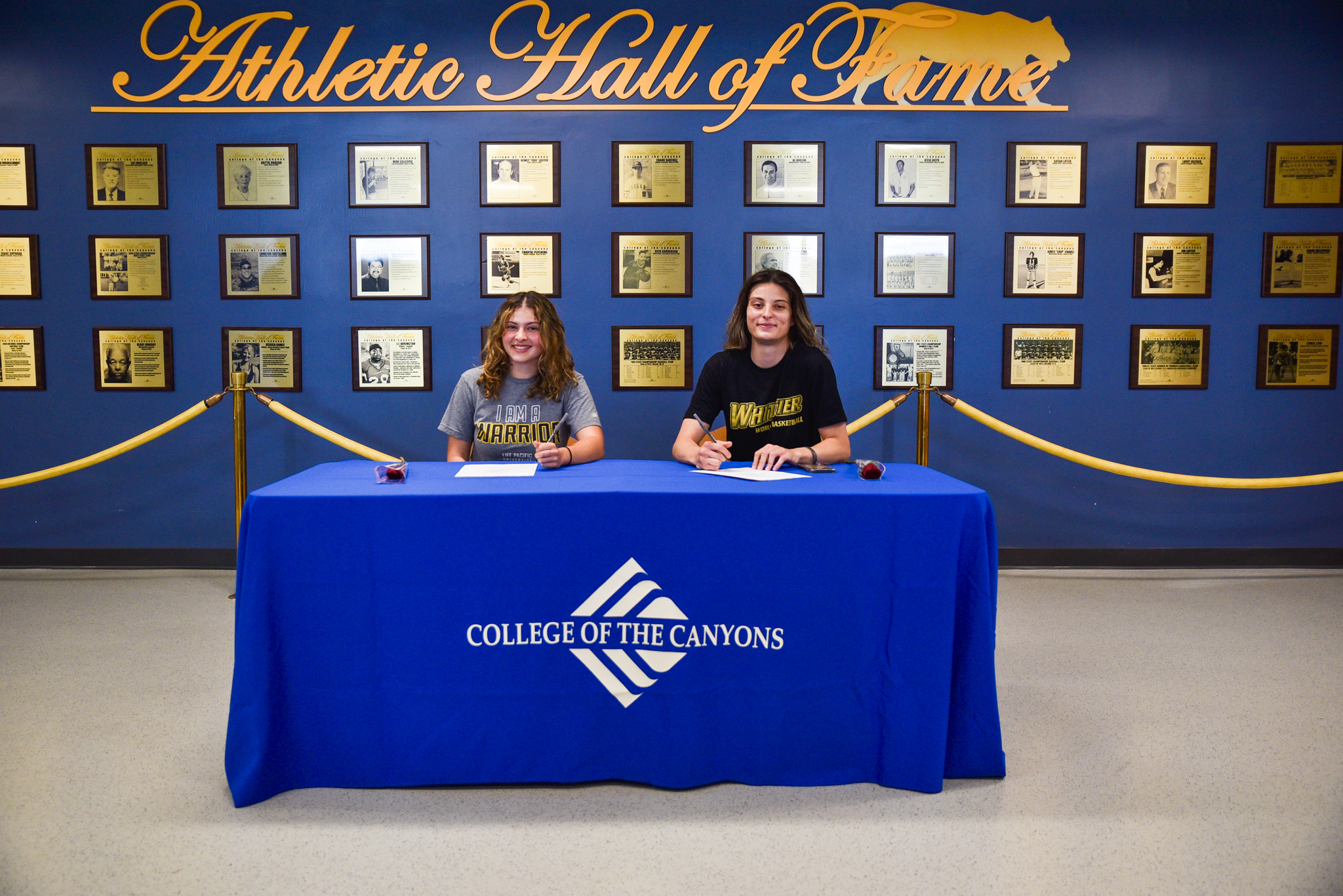 College of the Canyons women's basketball players Natalie Satamian and LuLu Salloom taking part in a signing day ceremony on July 21, 2023.