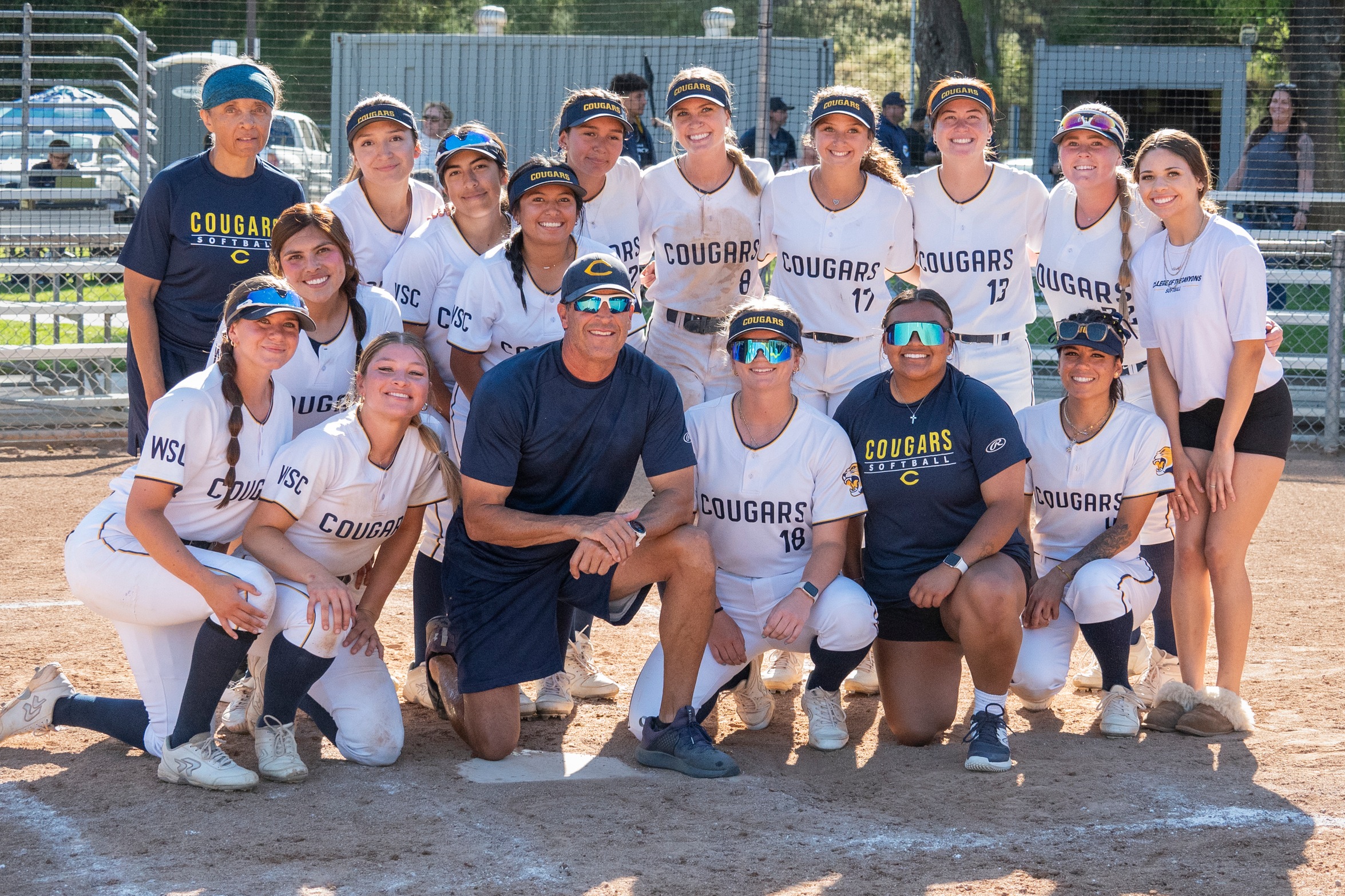 College of the Canyons softball team gathered around head coach John Wissmath after game vs. L.A> Mission College on Tuesday, April 9.