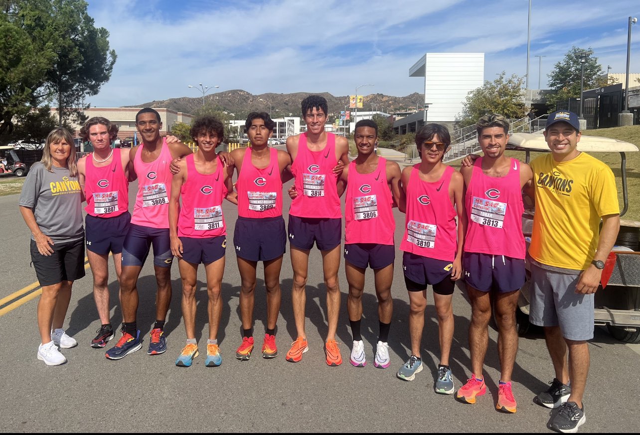 Stock image of College of the Canyons men's cross country team in pink jersies.