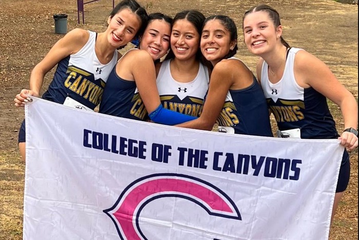 Group picture of College of the Canyons women's cross country at 2013 state championship meet in Fresno.